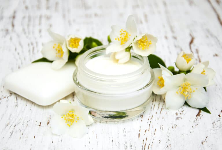 Cleansing balm jar with makeup being melted off