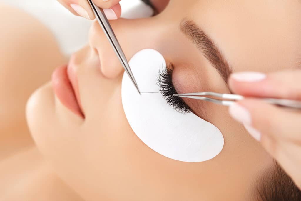 What Are Eyelash Extensions Made Of? - Beautygab Woman Getting Eyelash Extensions