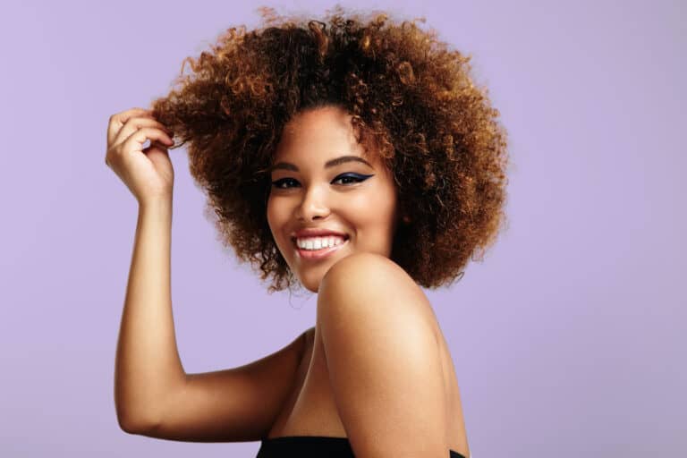 Woman Holding A Strand Of Her Hair