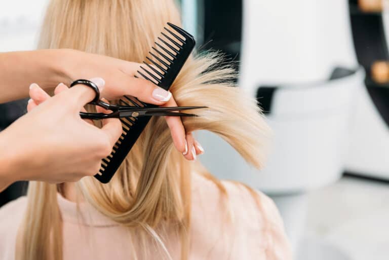 Blonde Hair Getting Trimmed At Salon