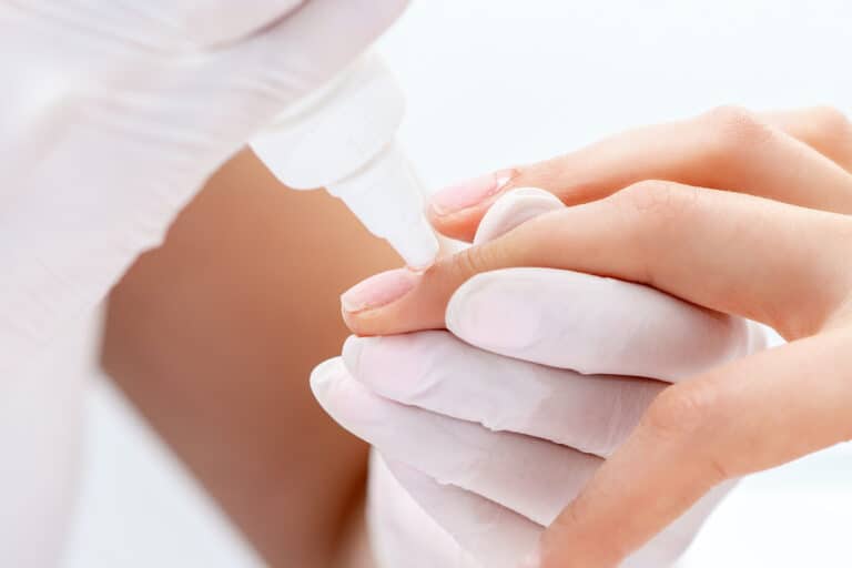 Manicurist Gluing Nails