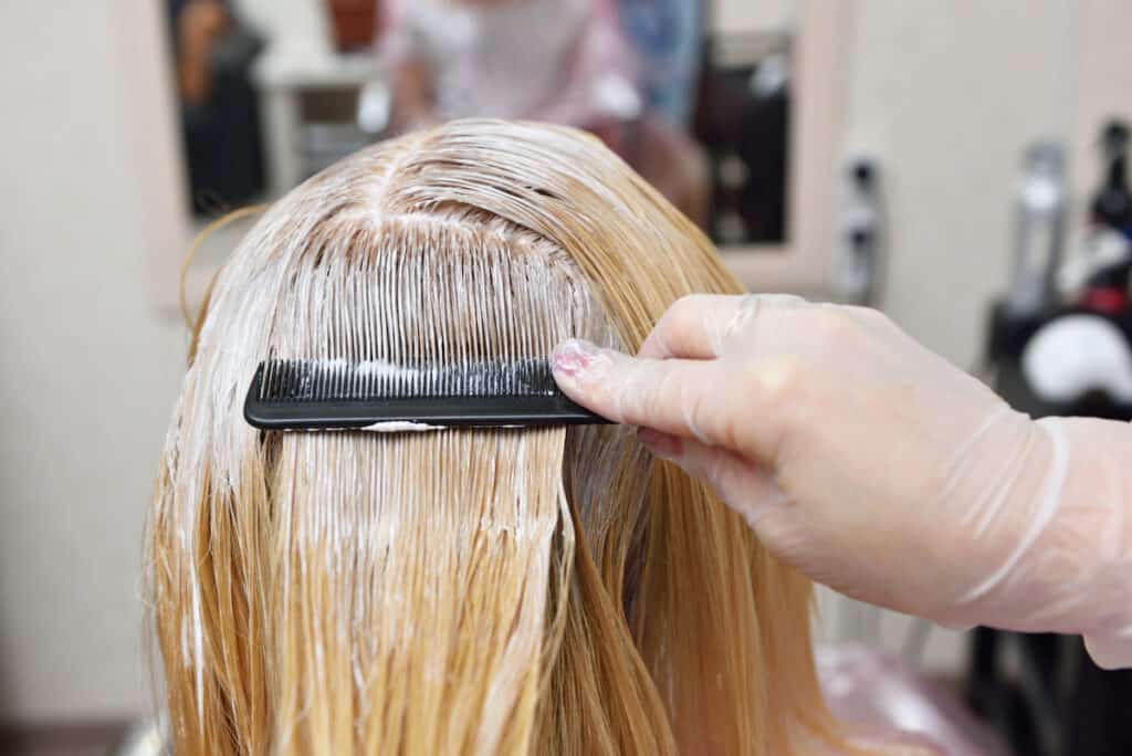 Does Bleaching Your Hair Damage It Forever? - Beautygab Woman Getting Hair Bleached