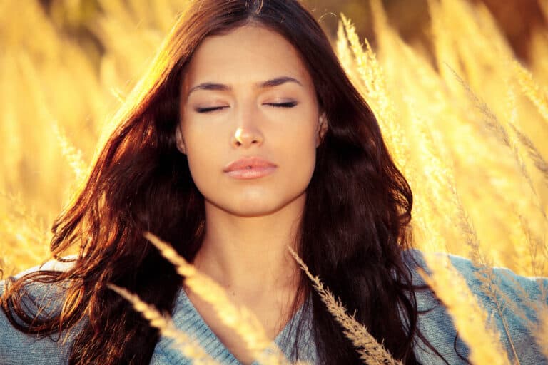 Woman In Sunlit Field