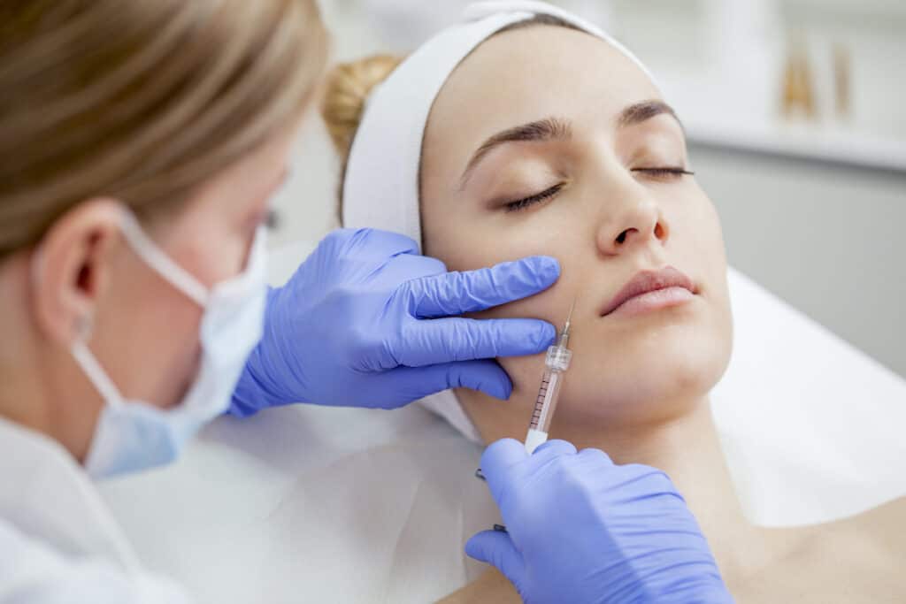 When Can You Shower After Botox? - Beautygab Woman Getting Botox