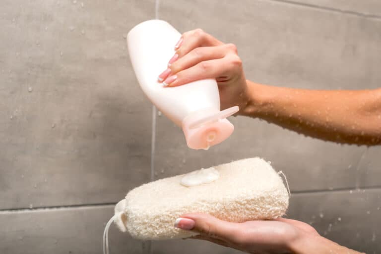 French body wash bottles in a shower
