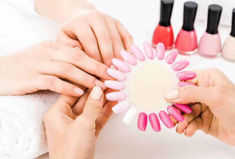 Bottles of Barbie pink nail polish in different shades