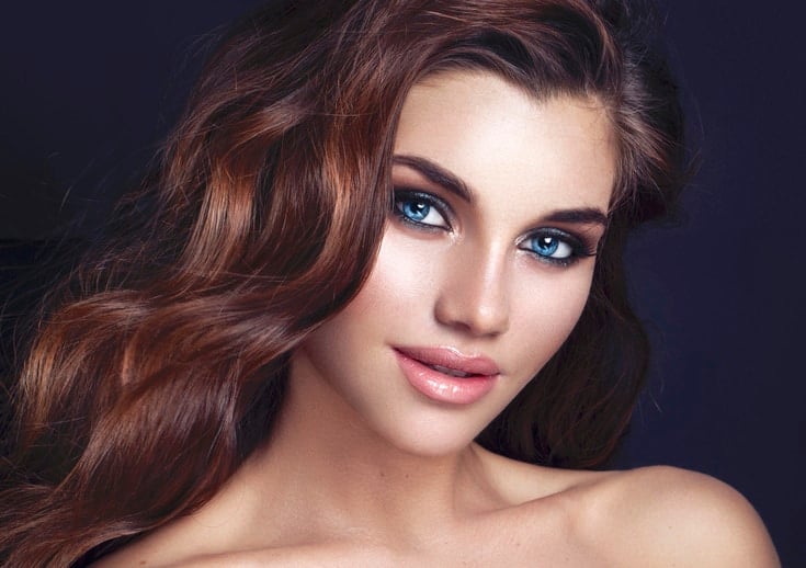 Fashion Glamour Makeup. Beauty Model Girl with Glamor Make-up and Hairstyle over Black Background. - Beautygab